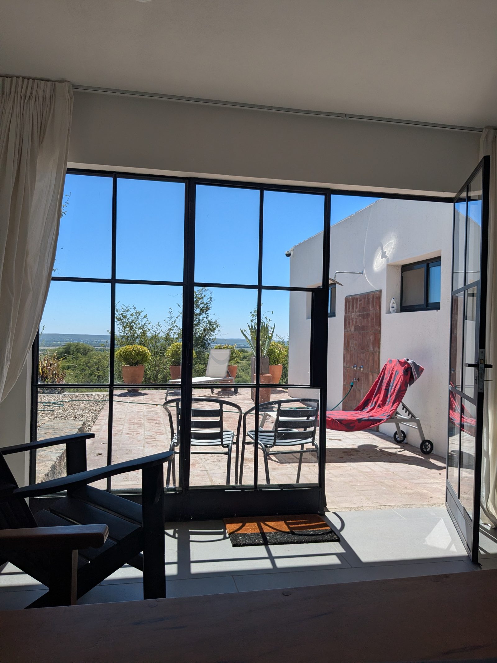 Steel-frame windows to terrace and valley